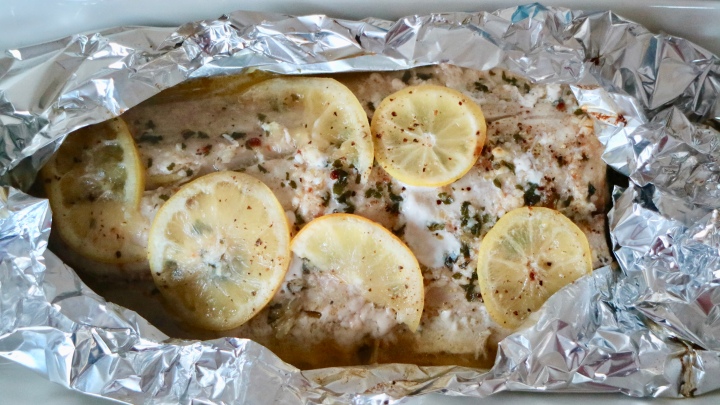 Grilled whole fish (mahi mahi) with garlic and lemon